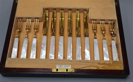 A George VI cased set of twelve pairs of mother of pearl handled silver gilt dessert eaters by Charles James Allen